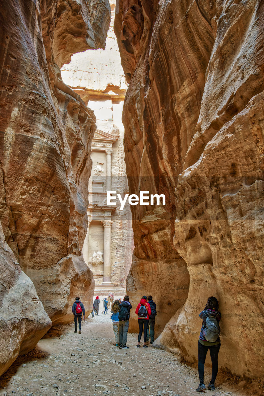 PEOPLE WALKING ON ROCK