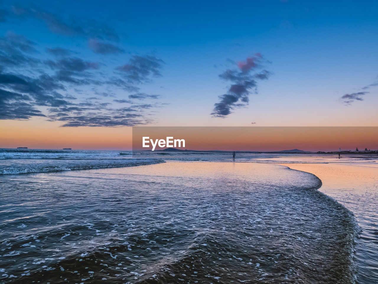 sky, water, sea, sunset, scenics - nature, beauty in nature, horizon, shore, nature, environment, land, ocean, cloud, dawn, reflection, blue, landscape, wave, tranquility, coast, beach, horizon over water, seascape, evening, tranquil scene, travel, travel destinations, no people, outdoors, sun, wind wave, dramatic sky, body of water, sunlight, idyllic, twilight, tourism, urban skyline, motion, coastline, summer, holiday, vacation, trip, architecture
