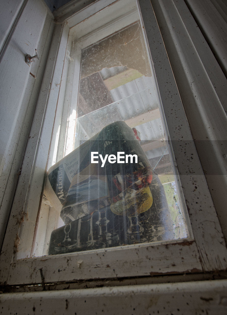 VIEW OF WINDOW OF DAMAGED BUILDING