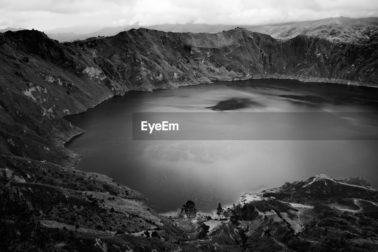Scenic view of crater lake against sky