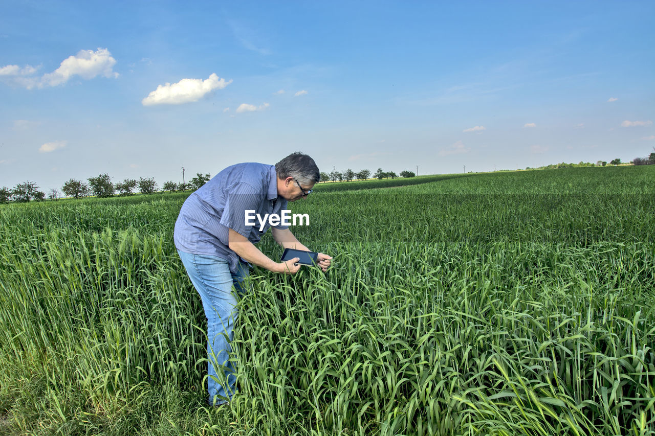 Full length of man standing on field