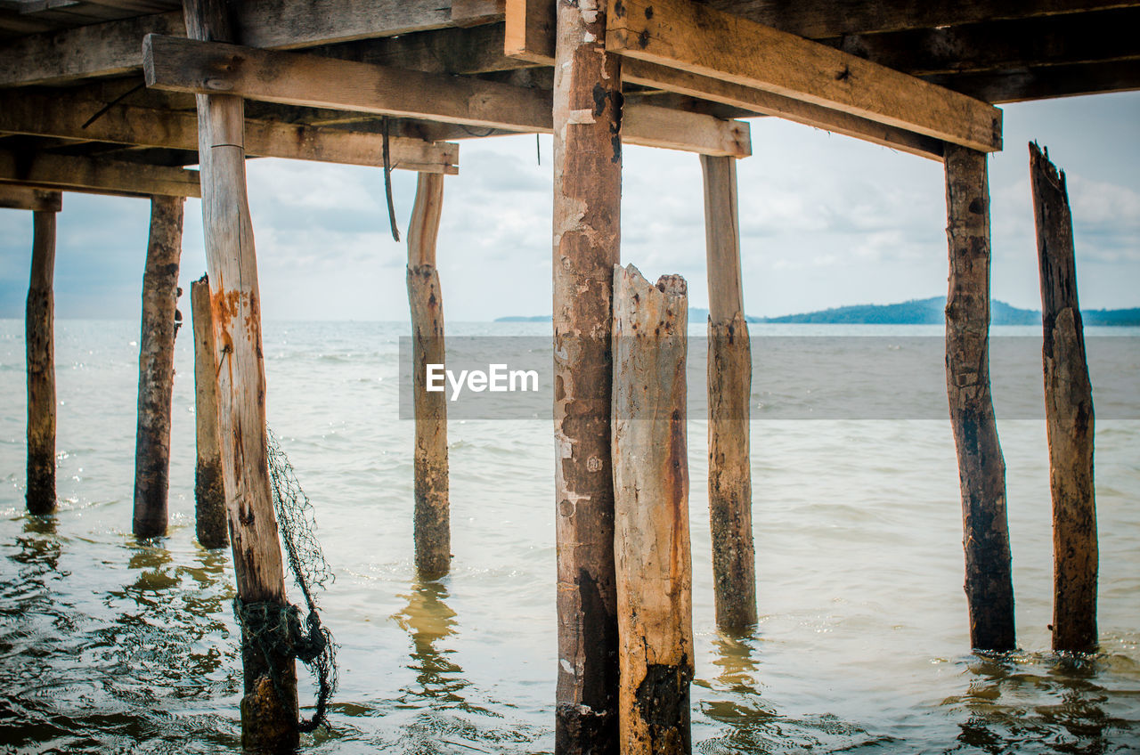 Underneath view of pier in sea