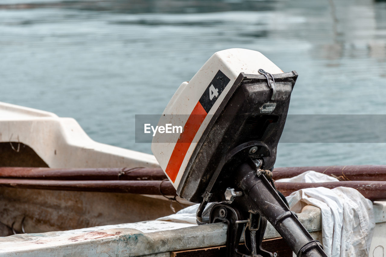 Close-up of retro outboard motor on old boat