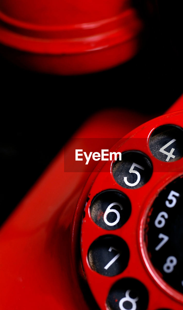 Close-up of red rotary phone