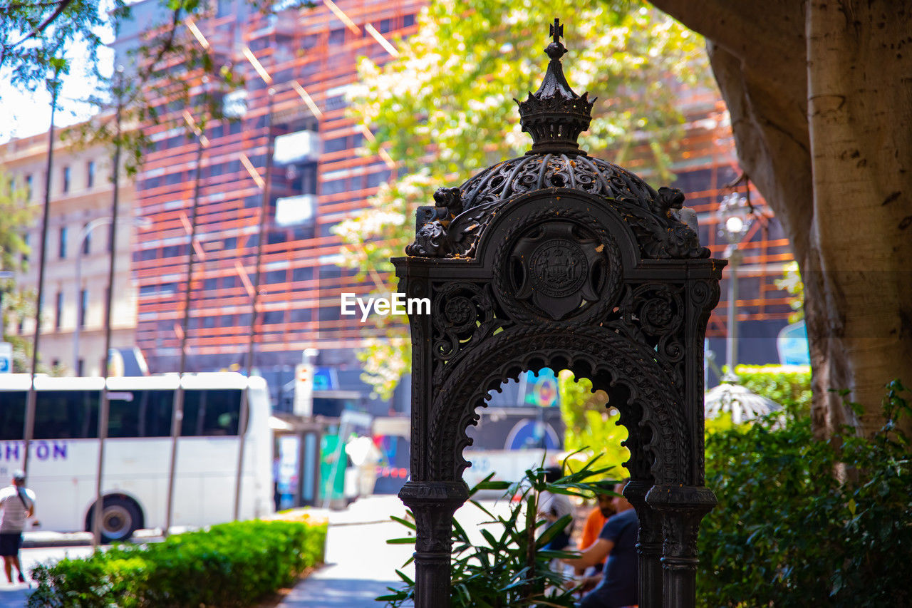 architecture, built structure, plant, building exterior, tree, nature, city, building, travel destinations, day, urban area, tourism, religion, travel, outdoors, history, no people, the past, landmark, belief, arch, temple, street, place of worship, transportation