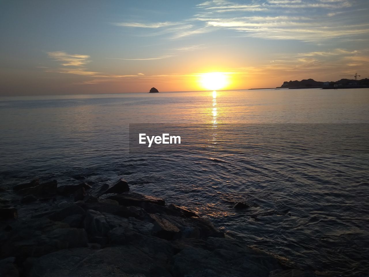 SCENIC VIEW OF SEA DURING SUNSET