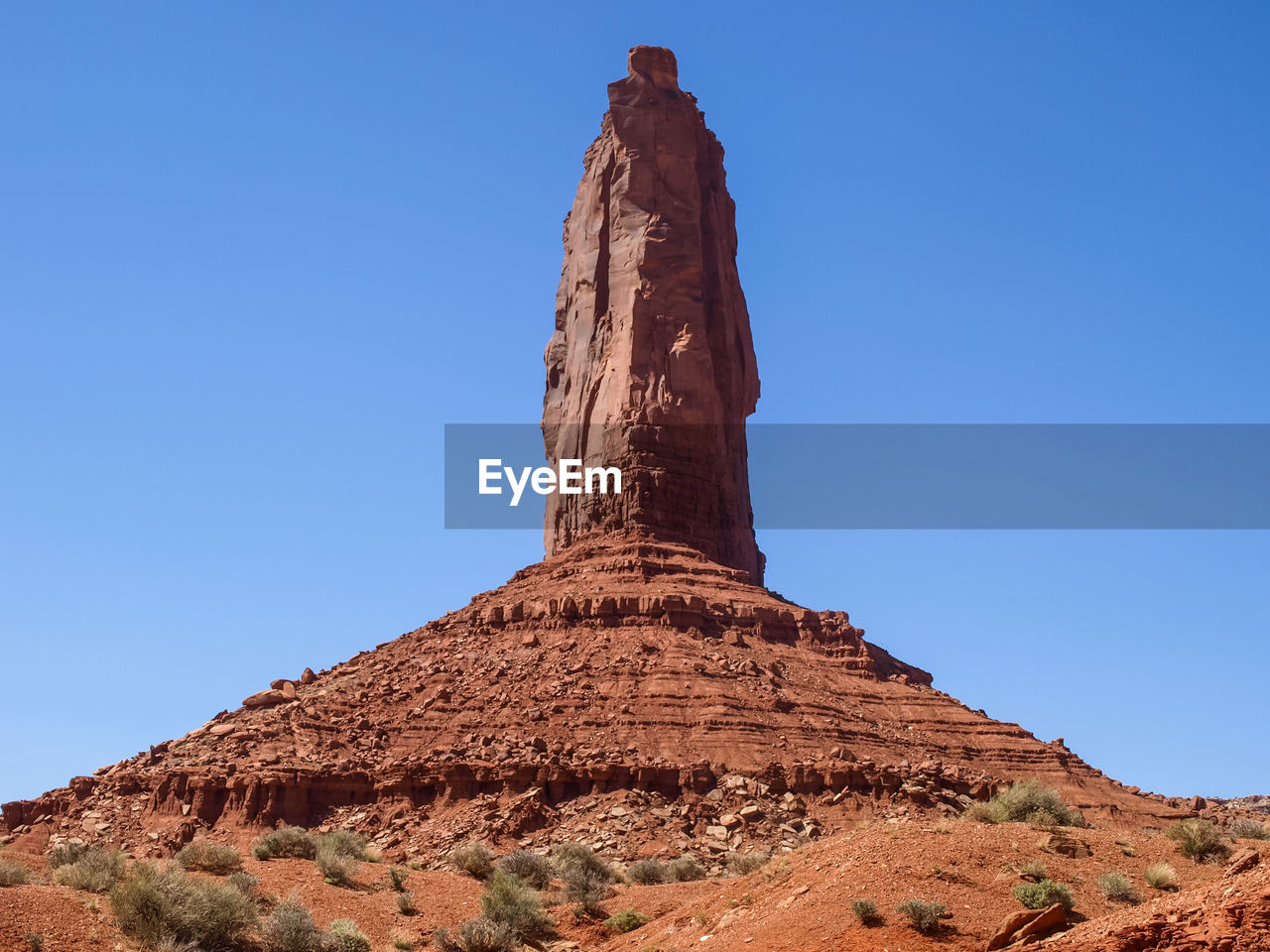 Low angle view of rock formations against blue sky