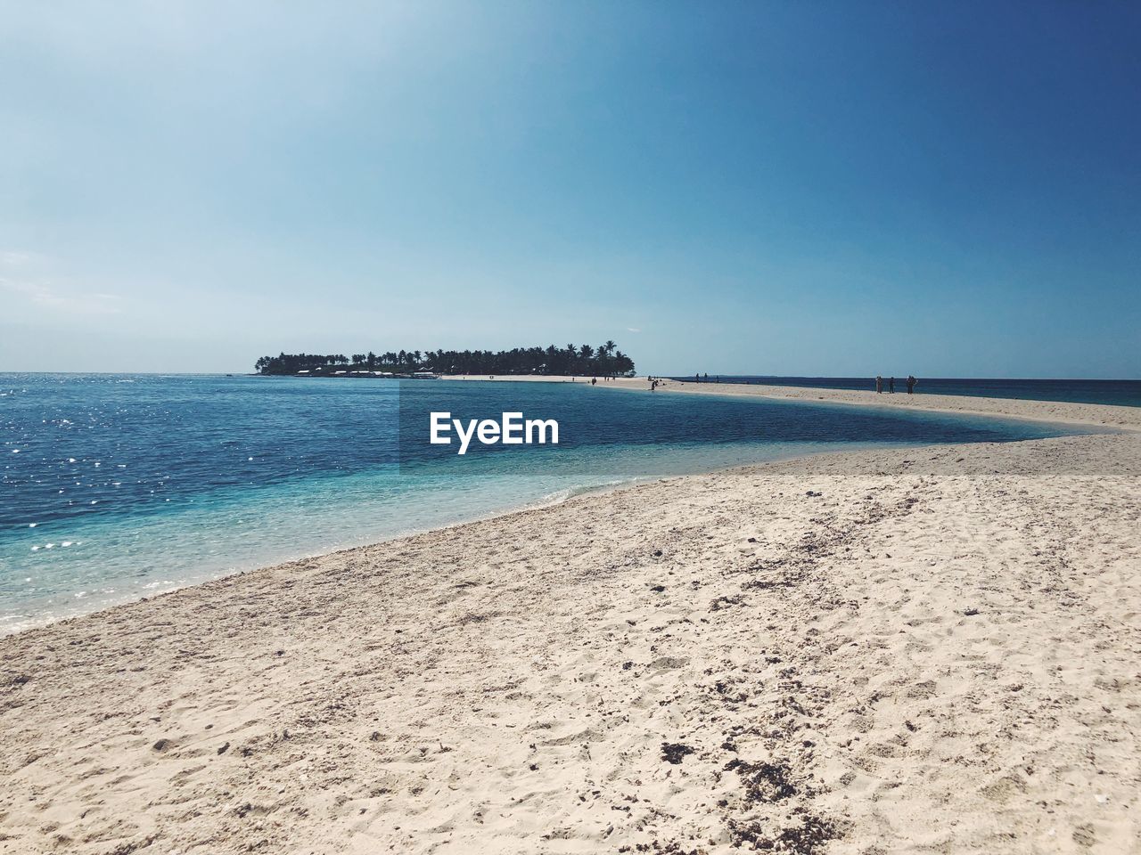 Scenic view of beach against clear sky