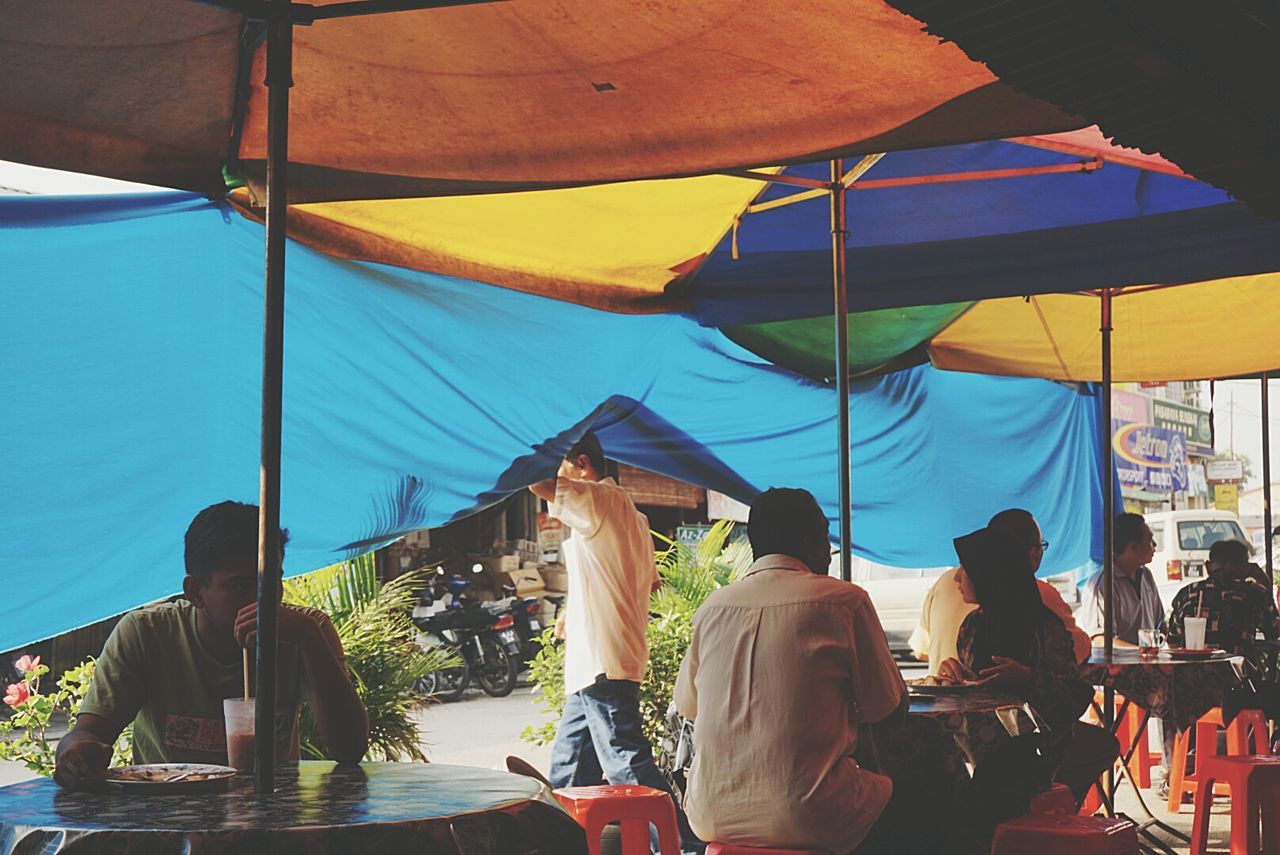 PEOPLE SITTING IN RESTAURANT