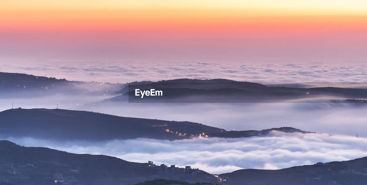 Scenic view of cloudscape against sky during sunset