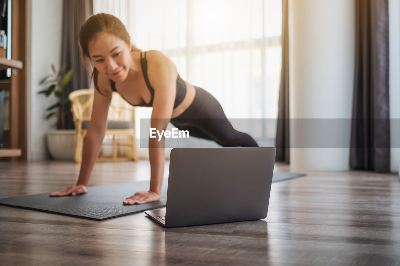 Young woman using laptop at office