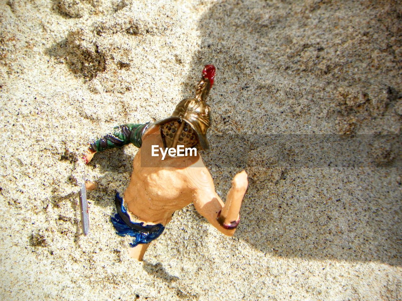 Close-up of toy on sandy beach