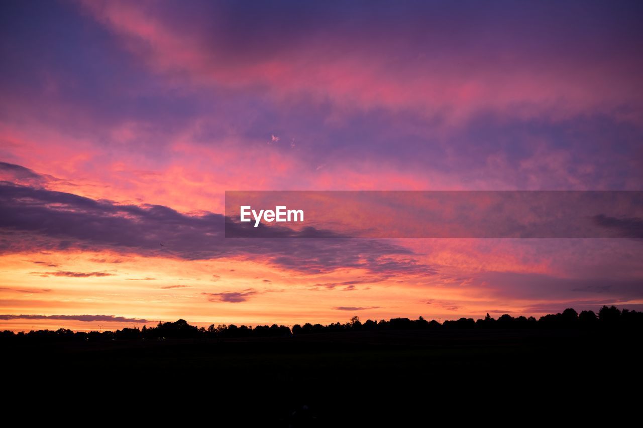 Silhouette landscape against sky during sunset