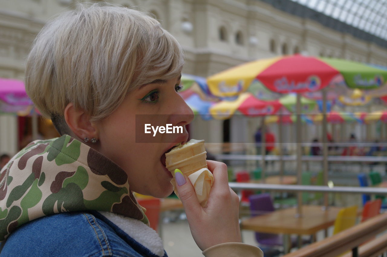 Portrait of a woman eating ice cream