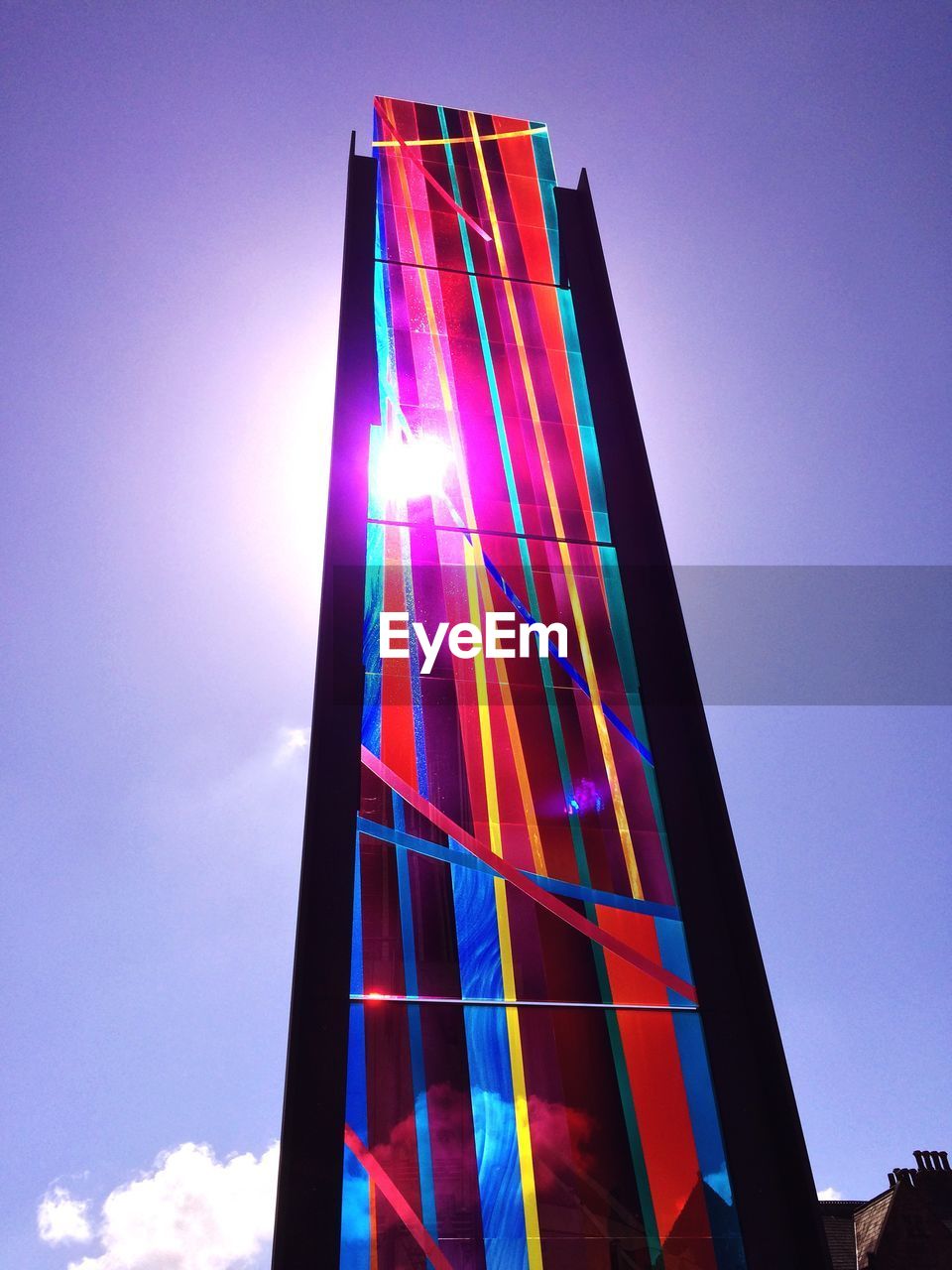 LOW ANGLE VIEW OF MODERN BUILDINGS AGAINST BLUE SKY