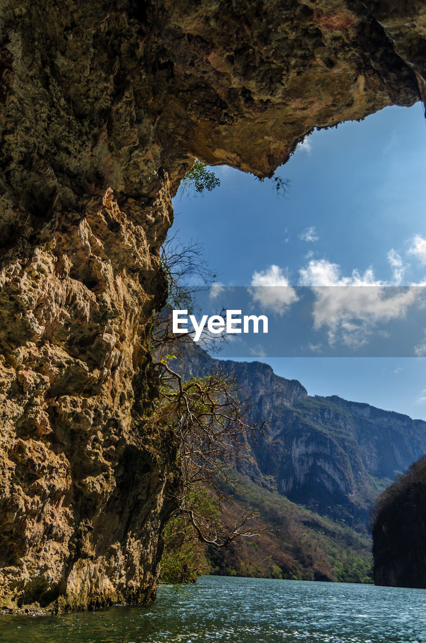 Sumidero canyon seen through cave on sunny day