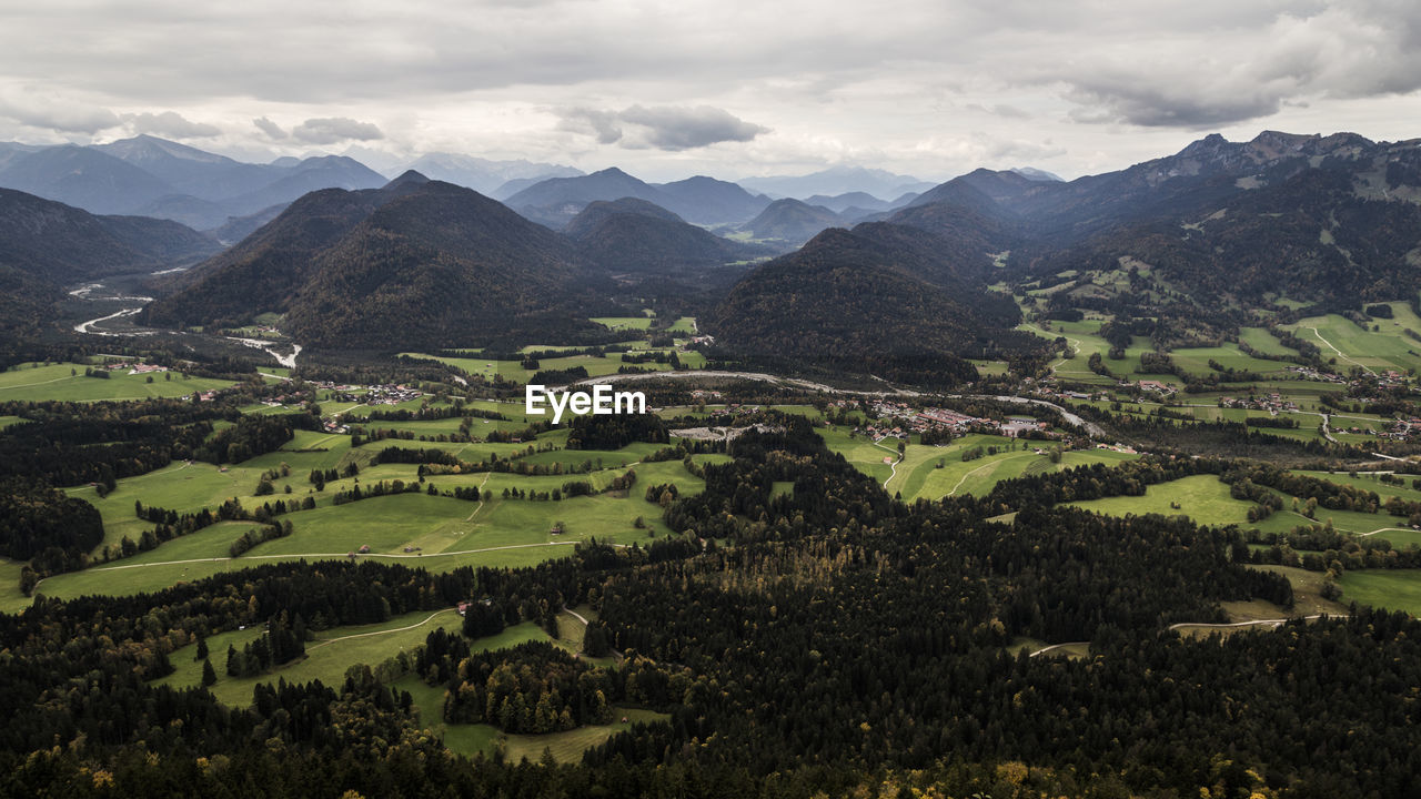 Scenic view of landscape and mountains against sky