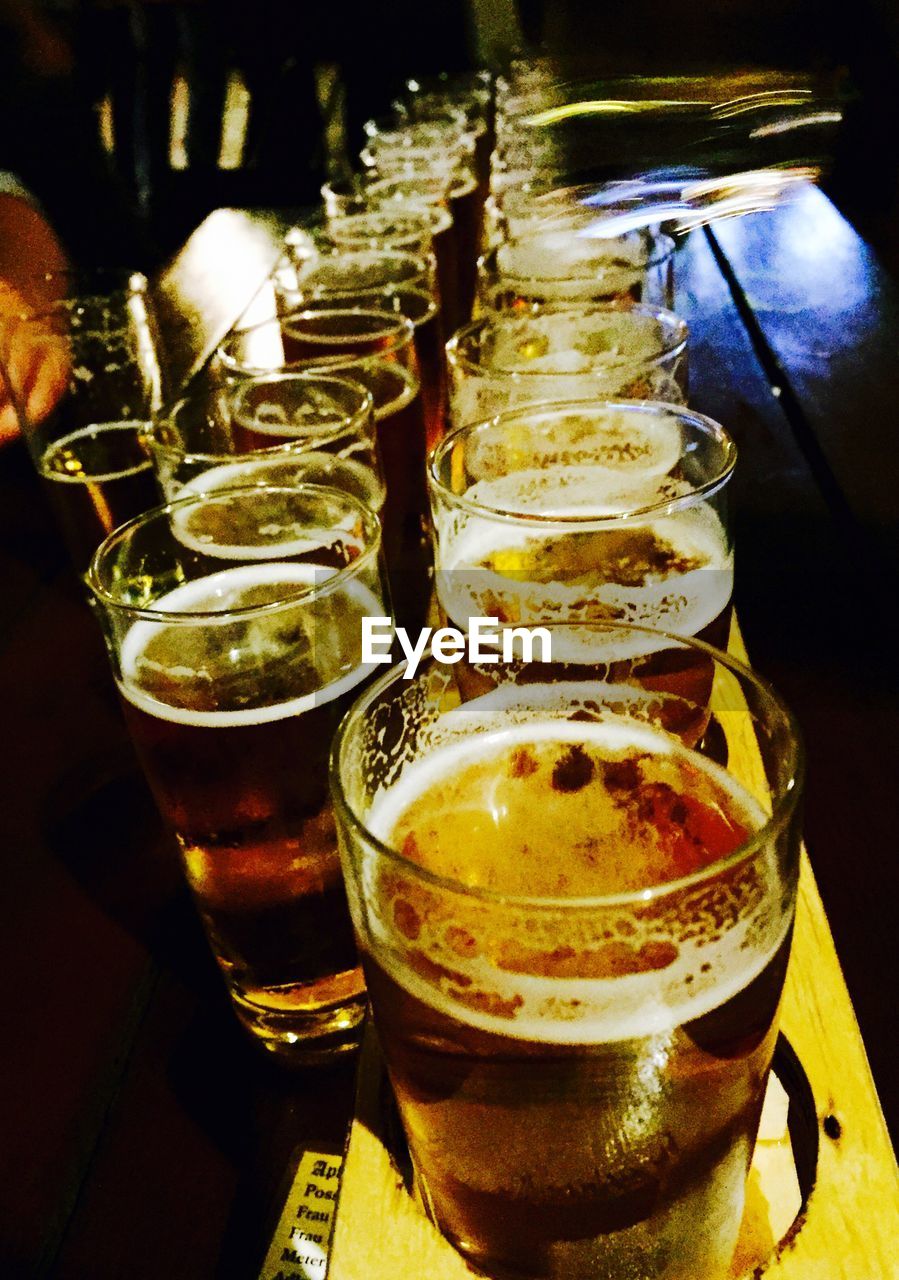 Row of beer glasses on table