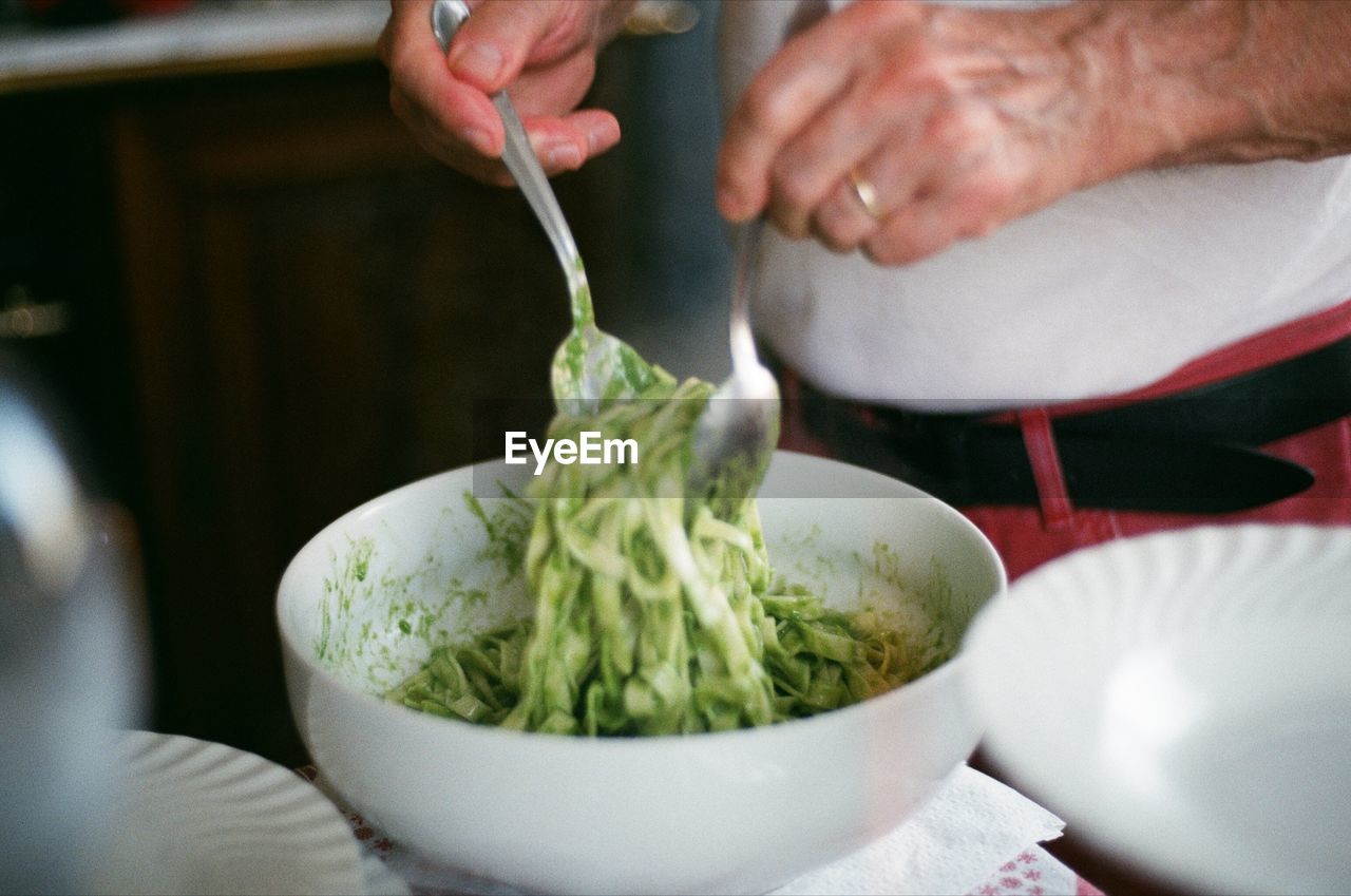 Midsection of woman preparing food on table