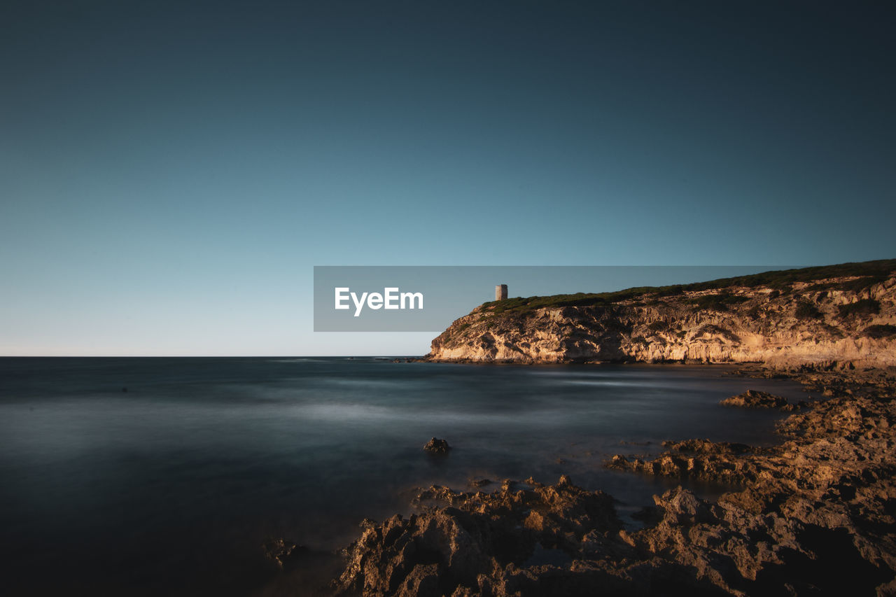 Scenic view of sea against clear sky