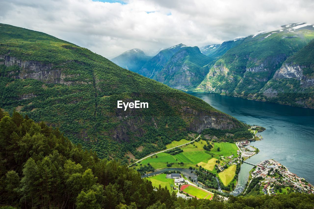 Scenic view of mountain against cloudy sky