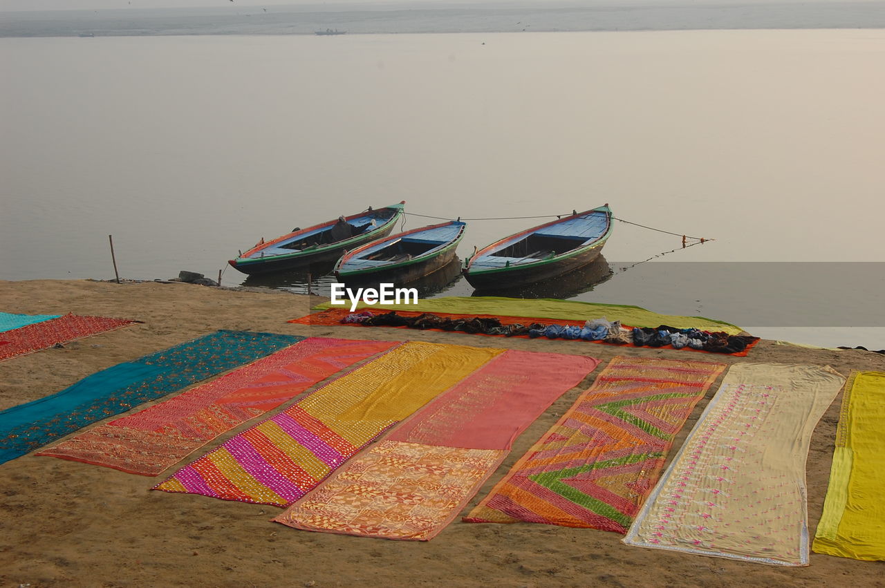 High angle view of fabrics on riverbank