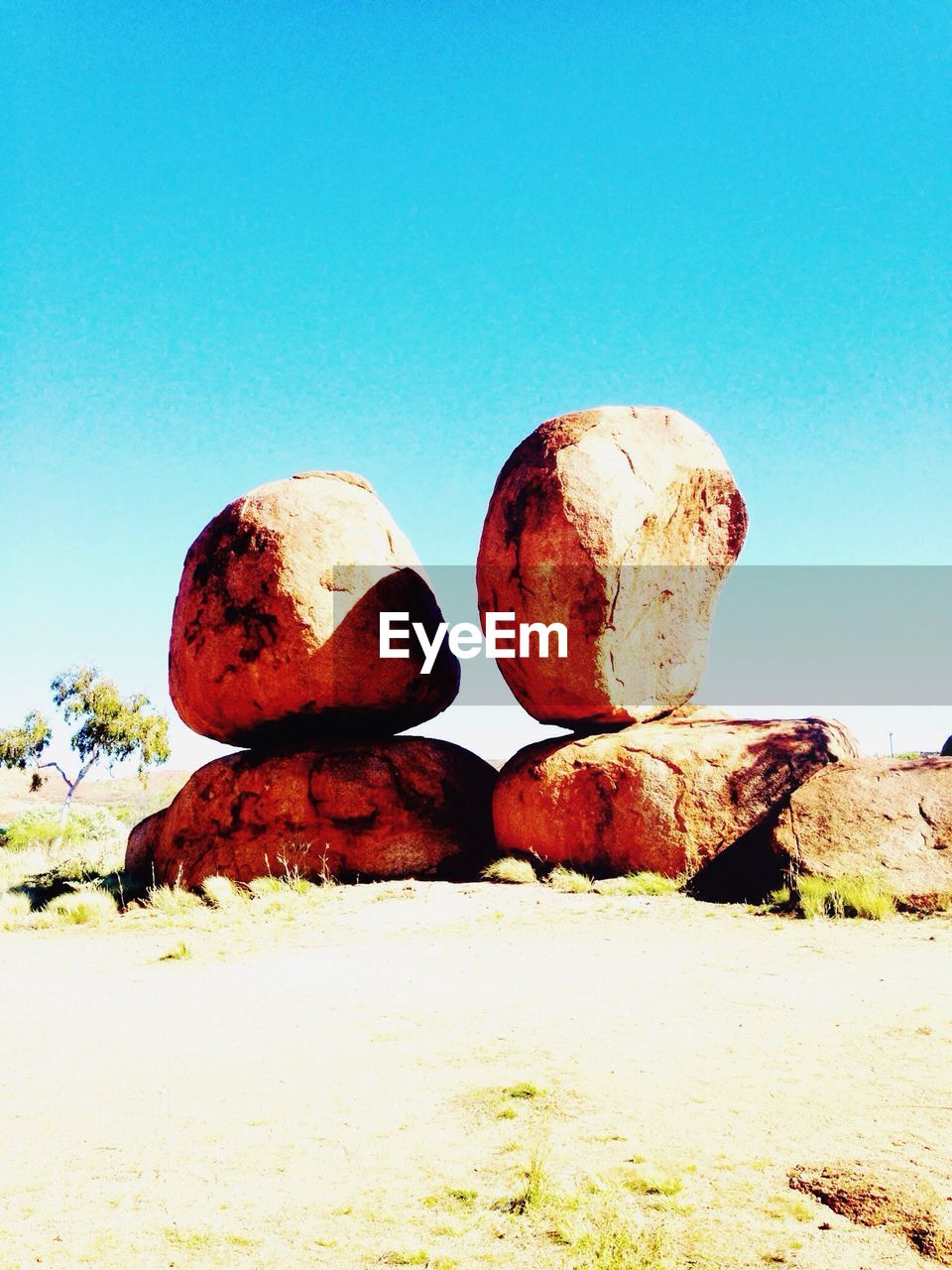 CLOSE-UP OF STONE AGAINST SKY