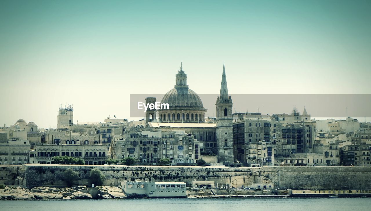 VIEW OF BUILDINGS WITH WATERFRONT