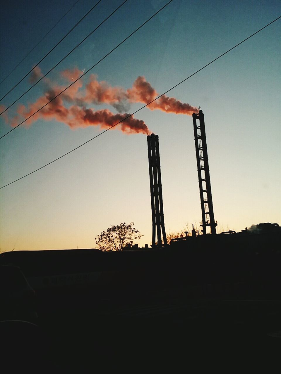 Low angle view of electricity pylon against sky