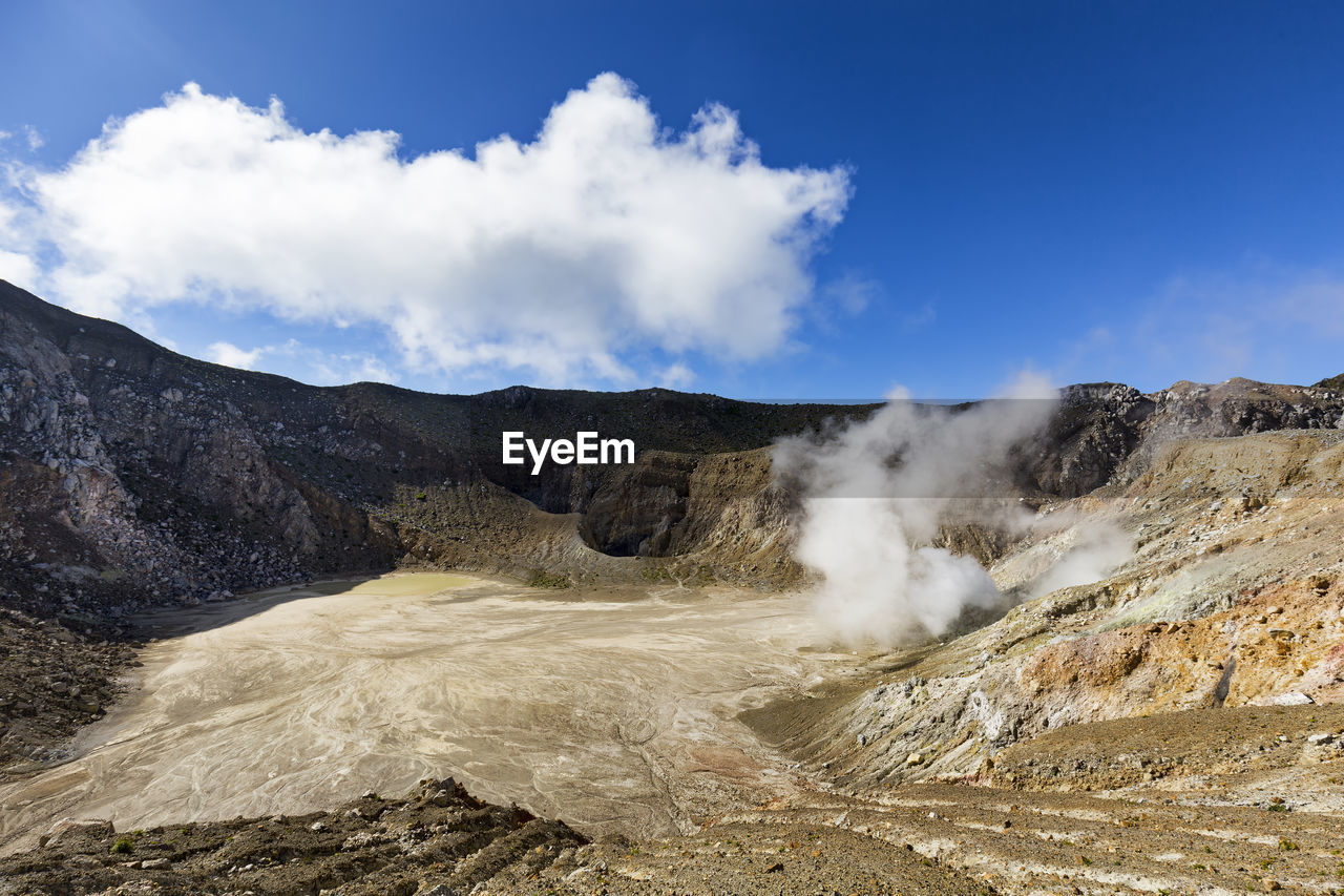 Scenic view of mountain against sky during sunny day