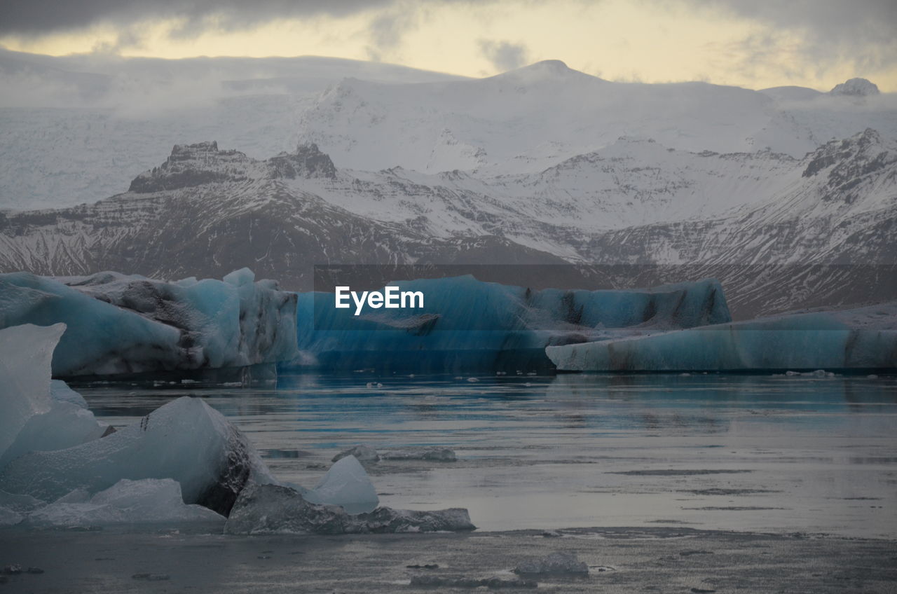 Scenic view of frozen lake against sky