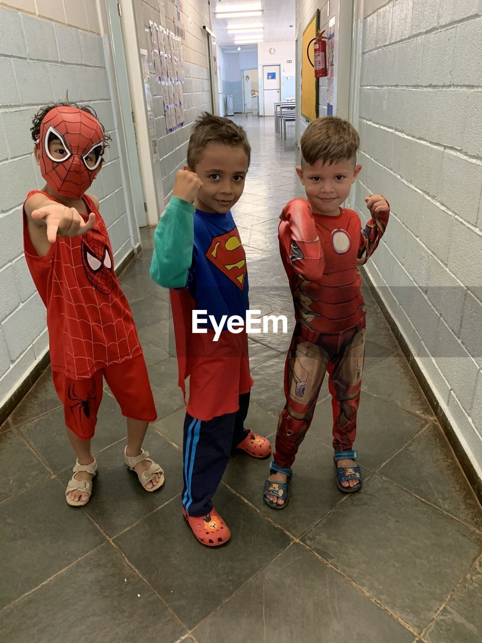 PORTRAIT OF BOYS STANDING ON FLOOR