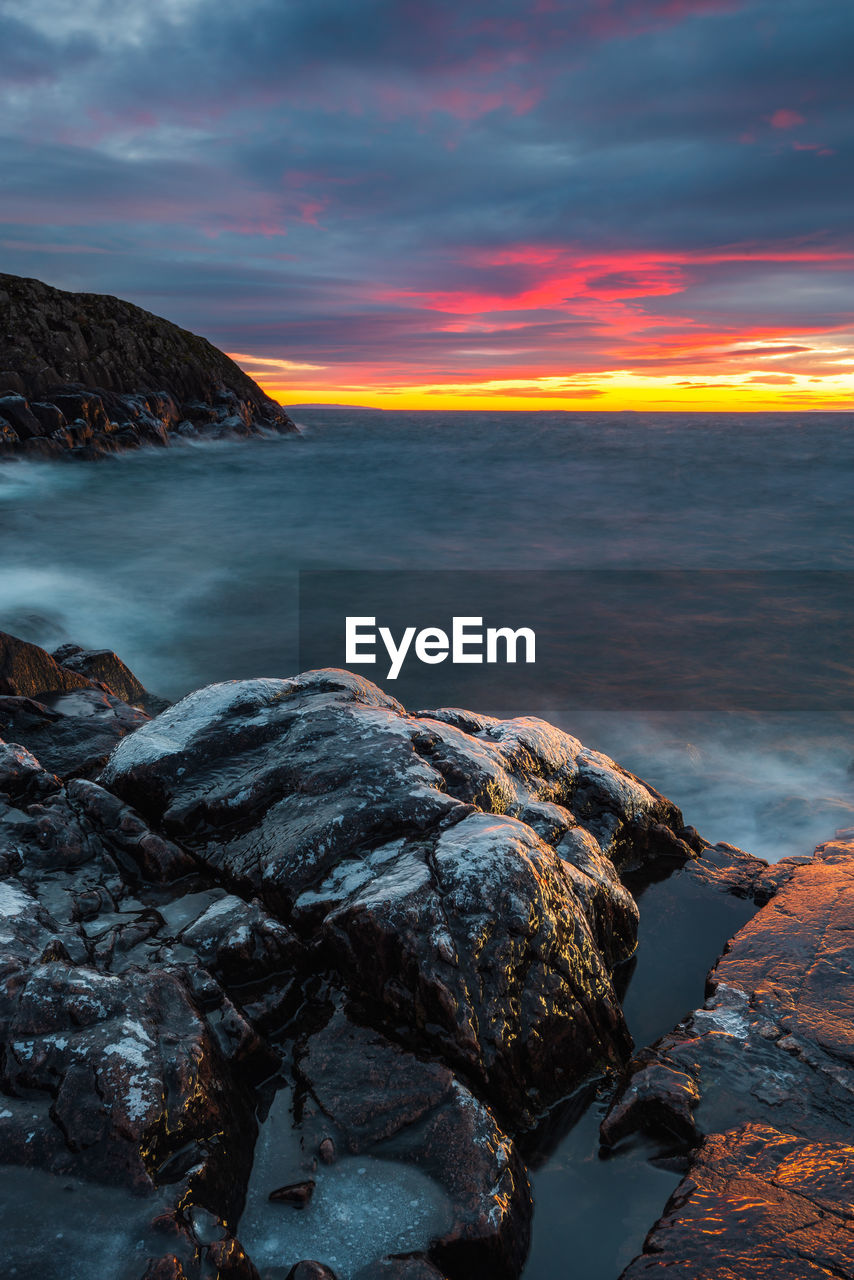 Scenic view of sea against sky during sunset