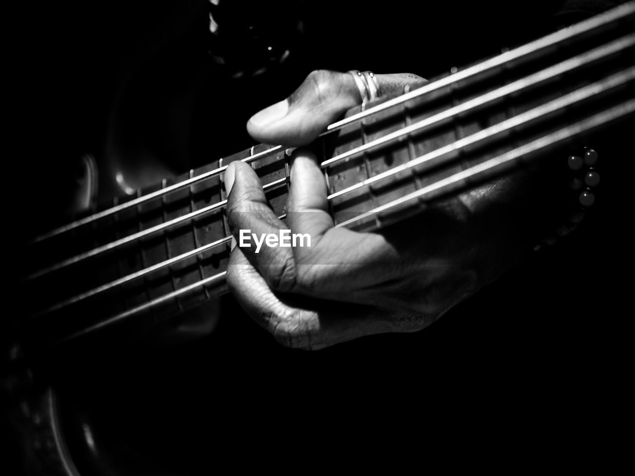 Close-up of hand playing guitar