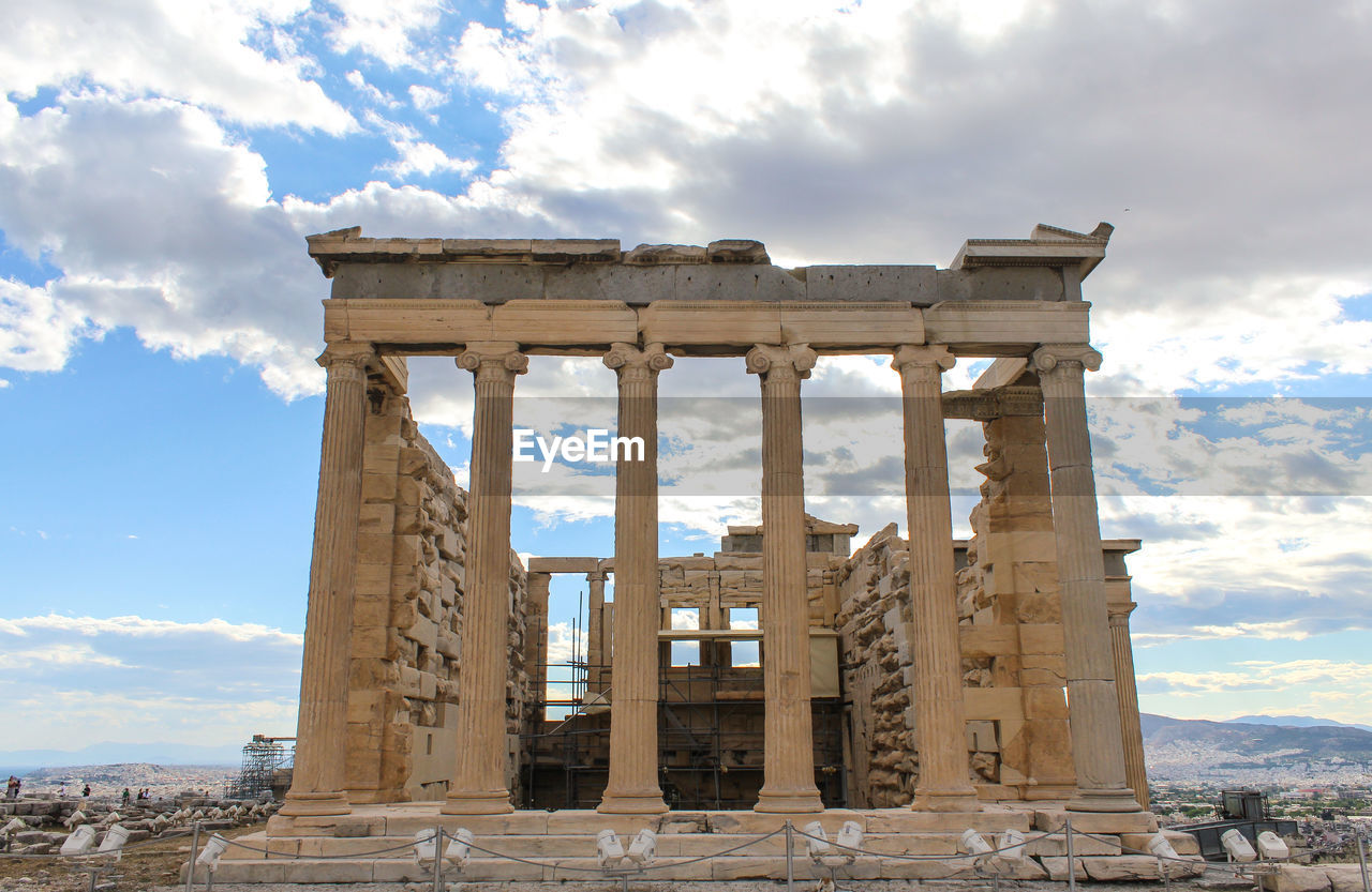 Historic monument at acropolis of athens against sky