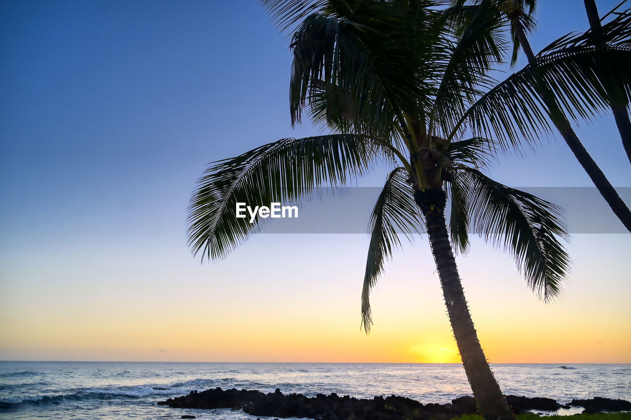 Scenic view of sea against sky at sunset