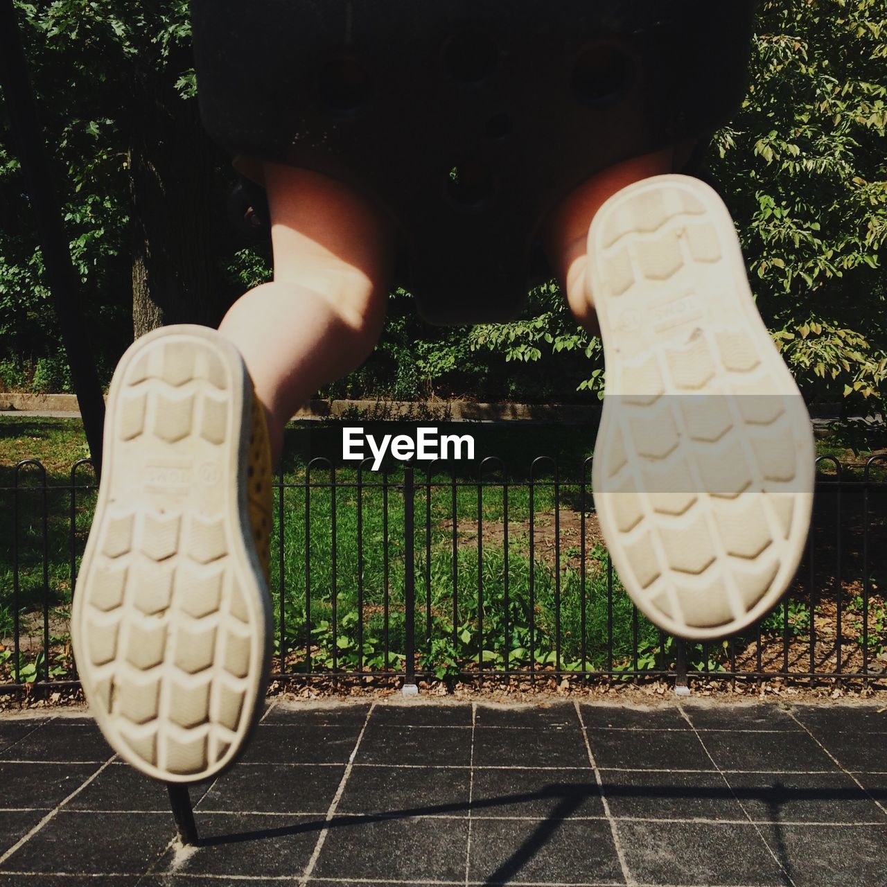 Close-up of child jumping outdoors