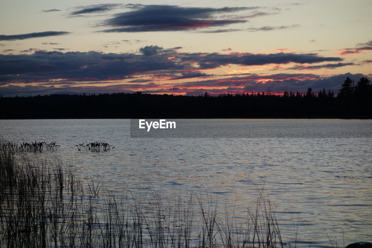 SCENIC VIEW OF LAKE DURING SUNSET