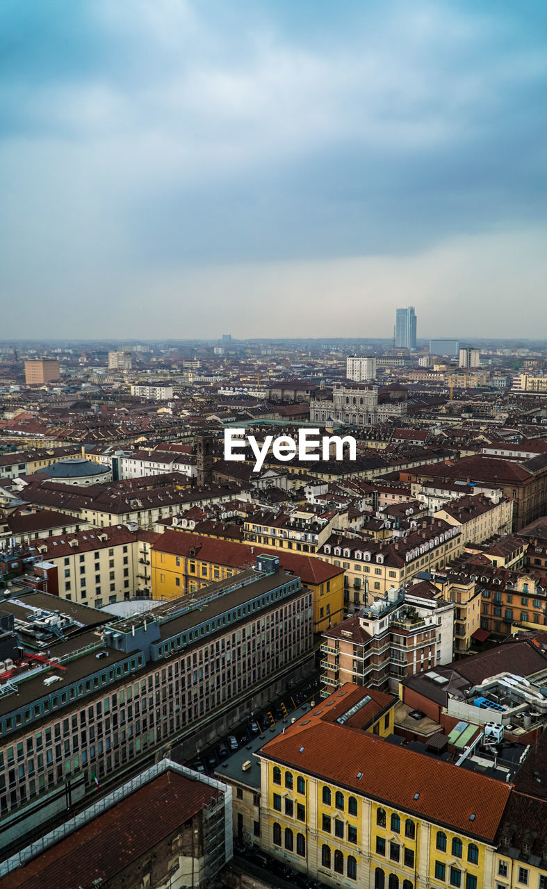 High angle view of buildings in city against sky