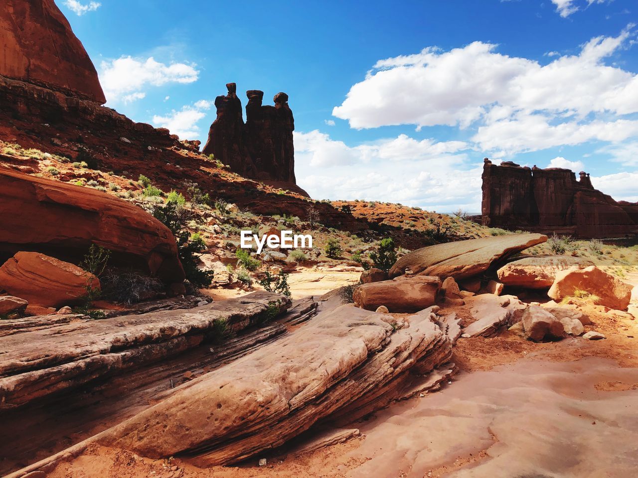 View of rock formations against cloudy sky