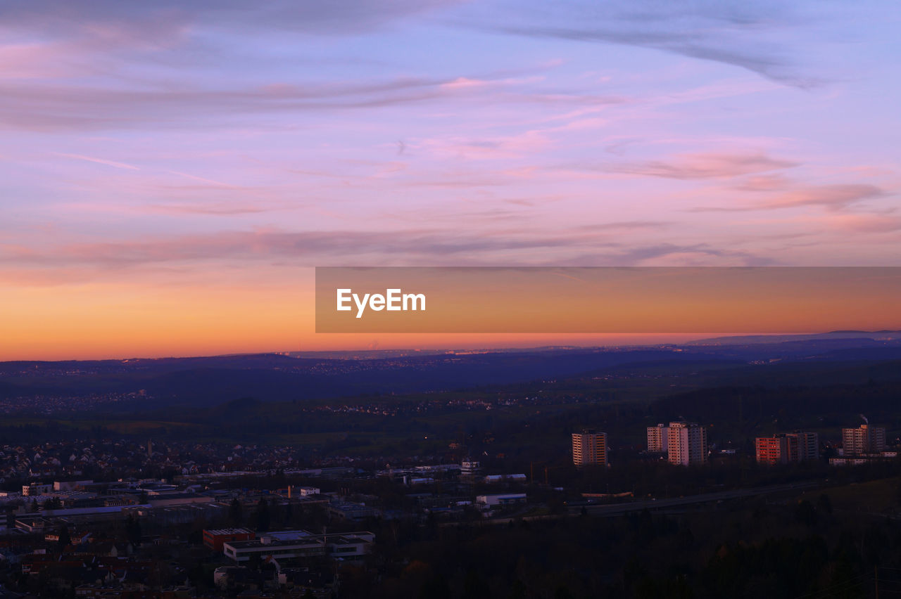 High angle view of buildings against sky during sunset