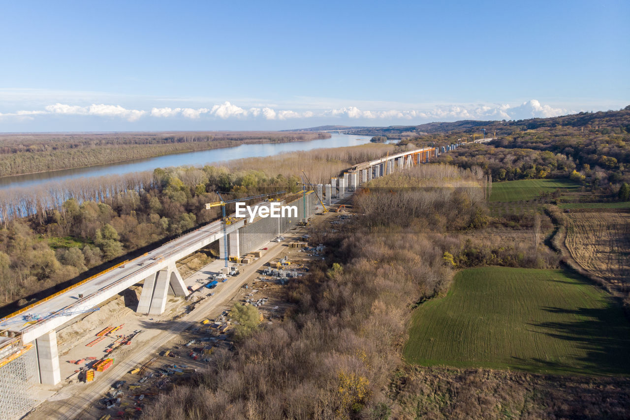 HIGH ANGLE VIEW OF BRIDGE ALONG LANDSCAPE