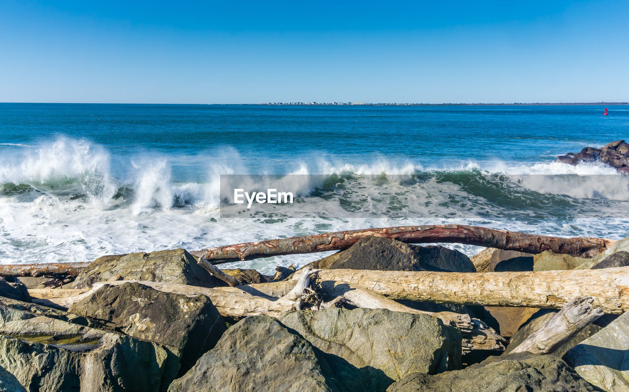 Waves roll onto the rock breakwater in westport, washington.