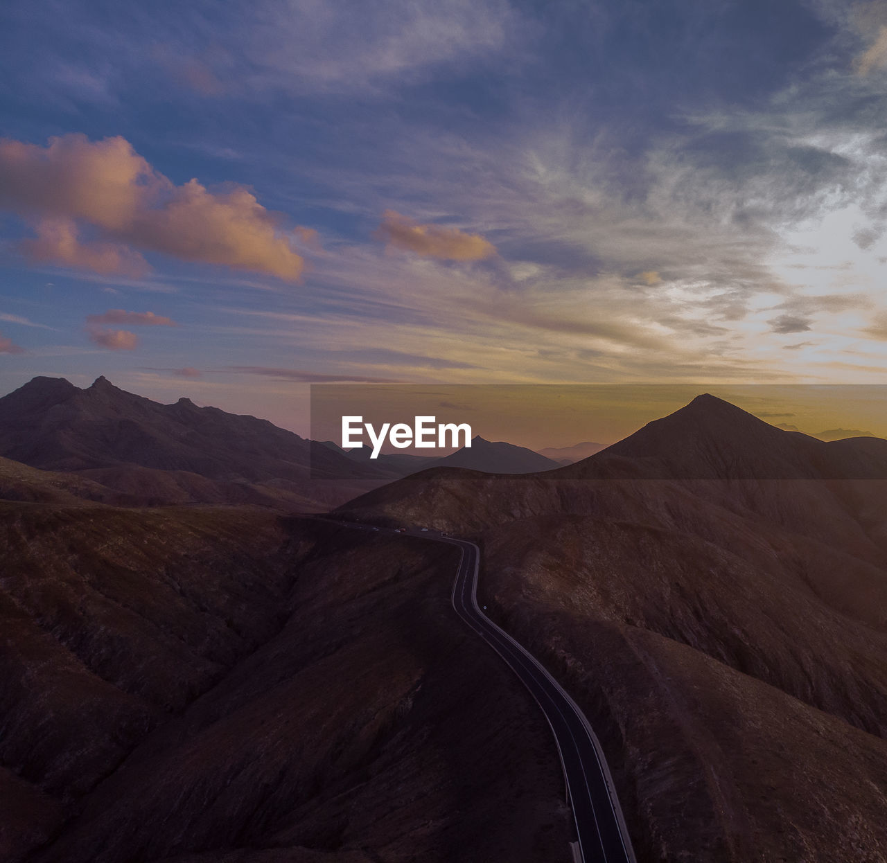 Scenic view of mountains against sky during sunset