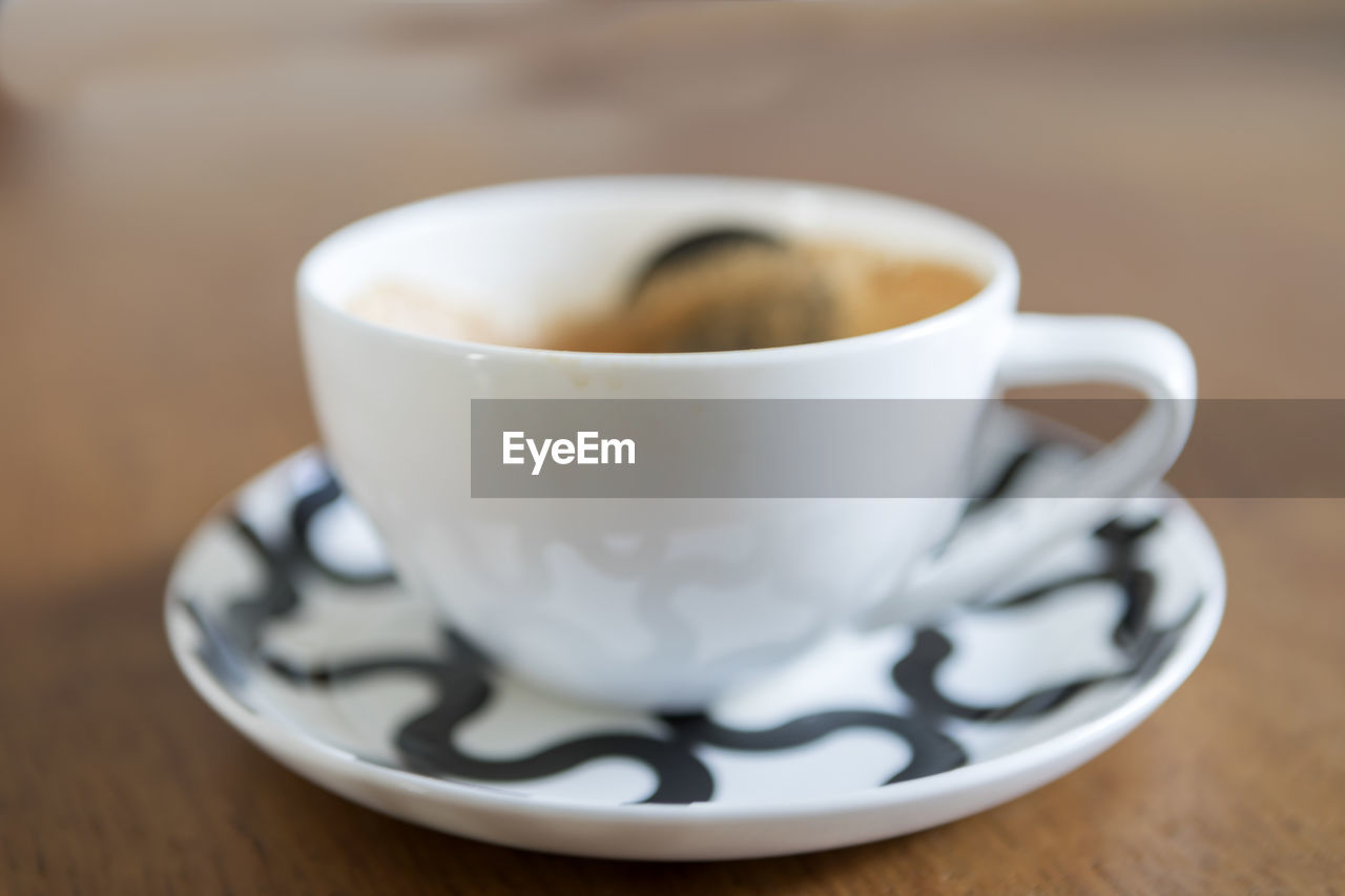 COFFEE CUP ON TABLE