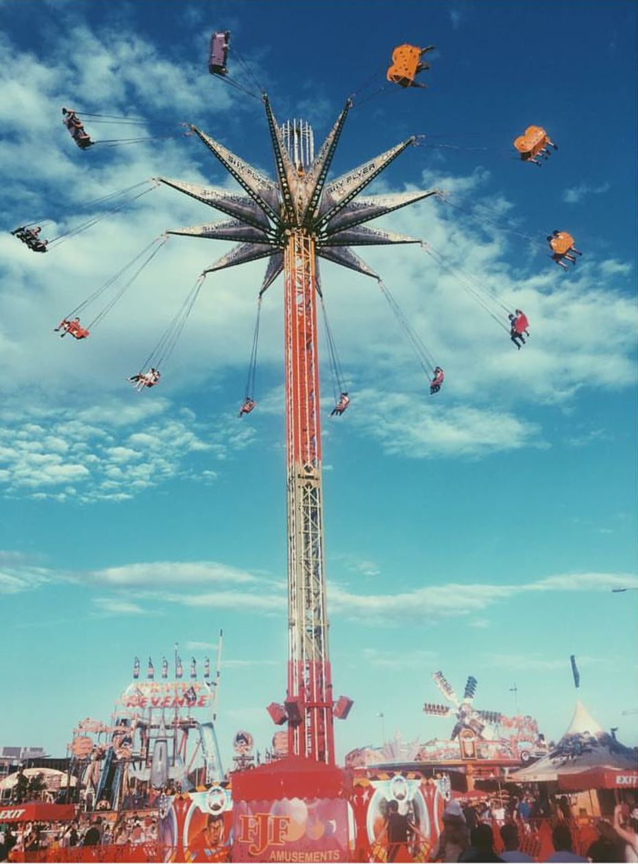 LOW ANGLE VIEW OF ROLLERCOASTER AGAINST SKY