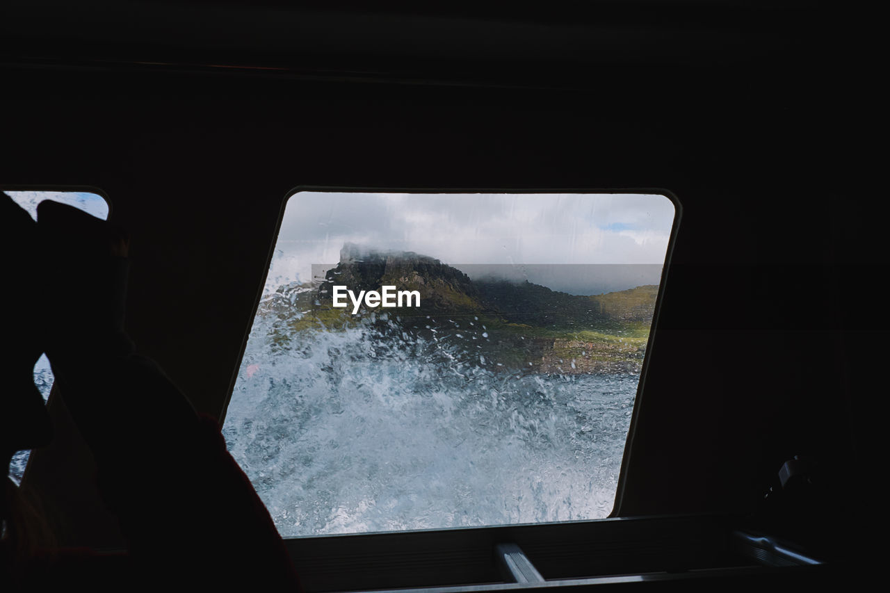 Sea seen through window of boat