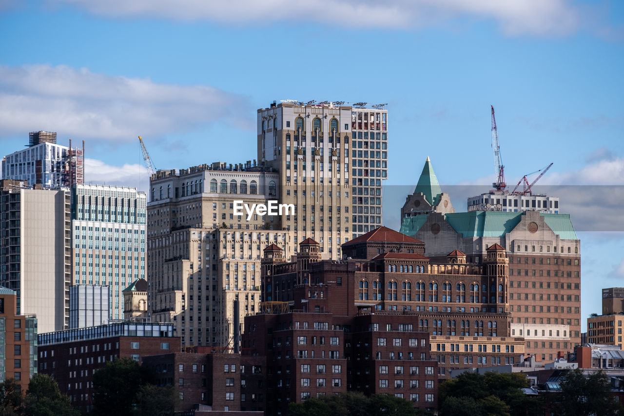 SKYSCRAPERS IN CITY AGAINST SKY