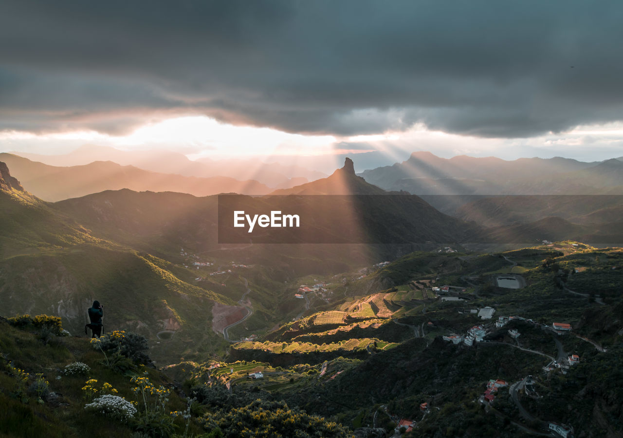 Scenic view of mountains against sky during sunset