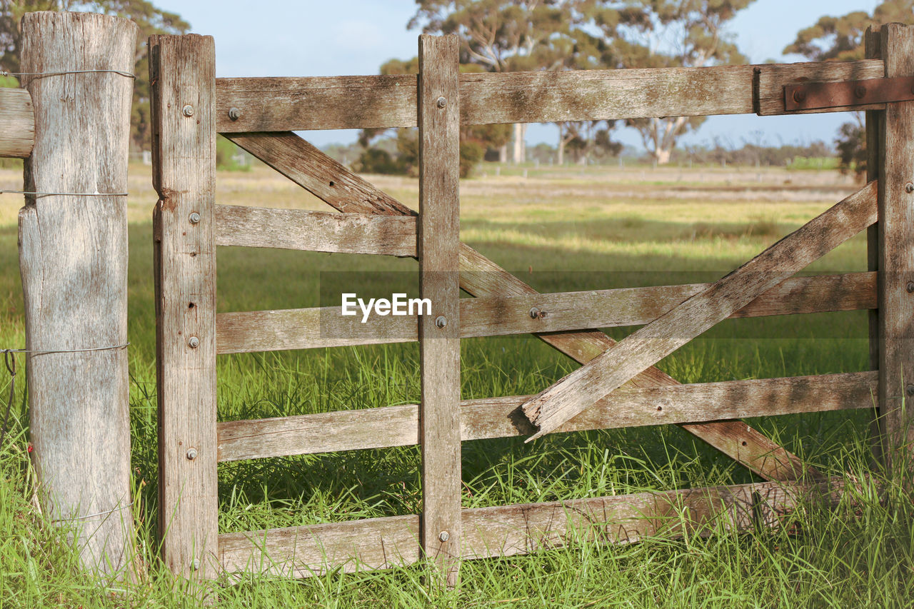 Old wooden gate in field